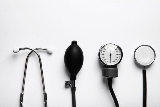 Black sphygmomanometer and medical equipment blood pressure monitor isolated on white background. Healthcare. Place for text. Medicine concept. The concept of cardiology.