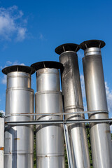 Side view of a Galvanized metal chimneys exhaust with a rain cap
