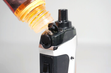 Refill with e-juice or liquid with salt nicotine on vape pod   