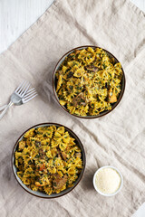 Homemade One-Pot Chicken and Mushroom Pasta in Bowls, top view. Flat lay, overhead, from above.