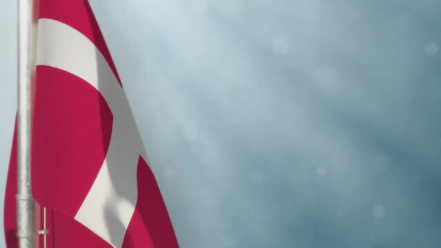 Waving Denmark flag on light blue bokeh backdrop