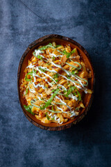 Poke bowl with quinoa salmon avocado and feta cheese on a dark background closeup
