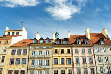 Fototapeta premium Colourful buildings of Warsaw's Old Town Market Square, which was completely destroyed during the World War II and later restored to its prewar appearance.