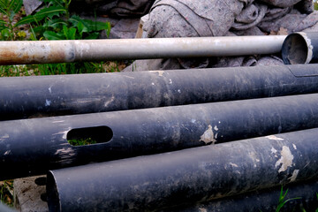 uncovered pipeline construction site, pipes with sand around it for making pipeline for heating...