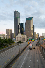 Seattle - July 09, 2022; City of Seattle skyline at dawn with Interstate 5 and a few vehicles in...