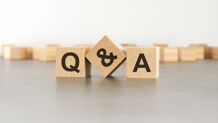 Q and A - question and answer shot form on wooden block