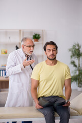 Young male patient visiting old male doctor