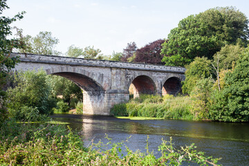 Fototapeta na wymiar Bridge over river with arches