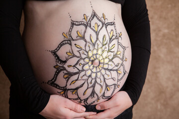 Mandala painting on pregnant baby bump