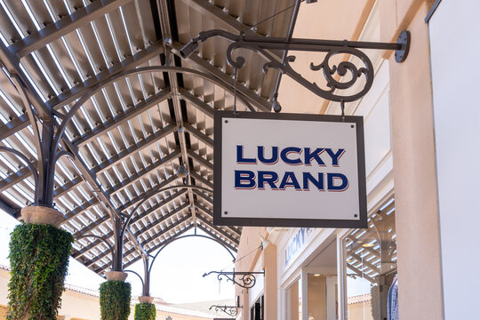 Newport Beach, CA, USA - July 10, 2022: Lucky Brand Store Hanging Sign At A Shopping Mall In Newport Beach, CA, USA. Lucky Brand Jeans Is An American Denim Company.