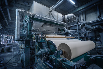 Paper production machine in wastepaper recycling factory. Paper and pulp mill. - obrazy, fototapety, plakaty