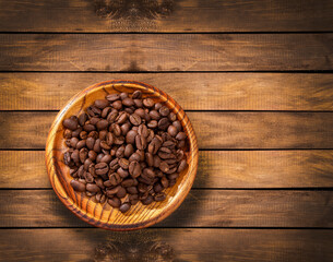 Coffea - Brown roasted coffee beans in the bowl
