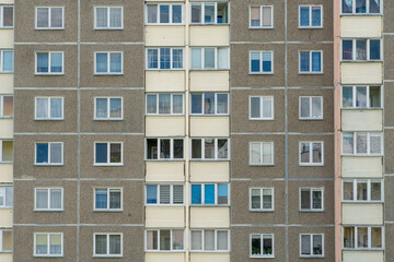Fototapeta na wymiar Beautiful modern multi-storey building in a new area of the city. View of the windows of an apartment panel house. An ordinary apartment building in a Russian city.