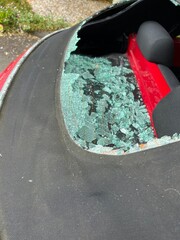 Close up of car accident smashed rear heated glass window on mohair black soft top convertible VW...
