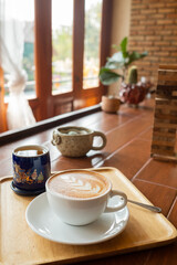 hot latte art coffee on wood table, relax time
