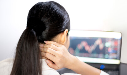 Naklejka premium Asian young feeling pain from work, while sitting in front of a laptop in their home. Concept working woman office syndrome.