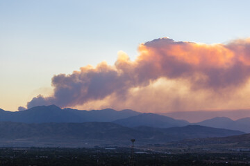 Naklejka na ściany i meble Smoke on mountain horizon from active wild fire in Utah, USA. 