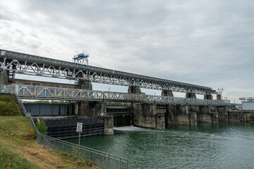 Fototapeta na wymiar A weir to control river flow of the Rhine River in Maerkt, Germany.