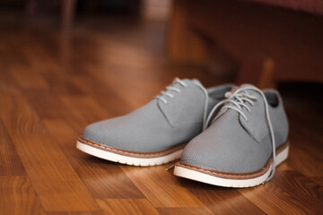 Grey man shoes on the floor