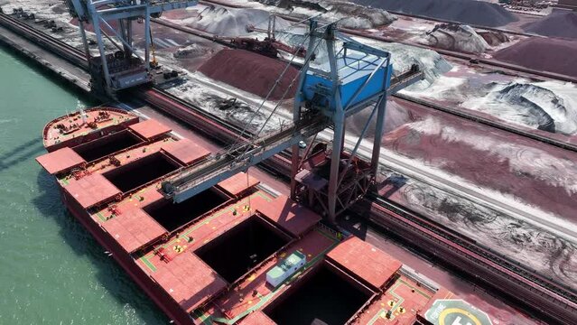 Bulk Carrier Ship Offloading Cargo By Crane for Processing