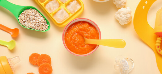 Healthy baby food in bowl on light background