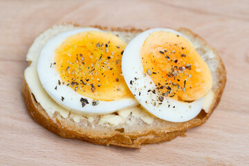 small open sandwich with boiled egg and black pepper selective focus
