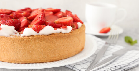 Plate with tasty strawberry cake on table, closeup