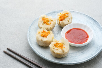 Steamed dumpling dimsum served in plate, close up.
