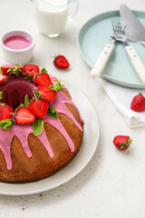 Plate with tasty strawberry cake on light table