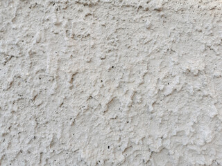 Unfinished stucco concrete wall texture background.  Rough cement wall background.