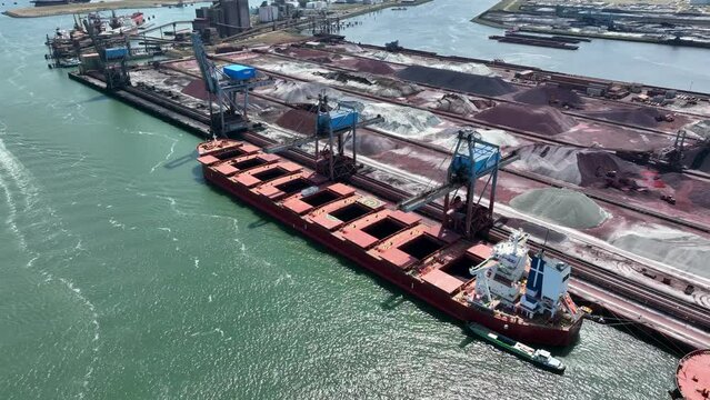 Bulk Carrier Ship Offloading Cargo By Crane for Processing