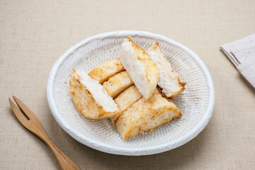 Kue Pancong, Gandos or Bandros is an Indonesian traditional snack made from a mixture of rice flour, grated coconut, and coconut milk.