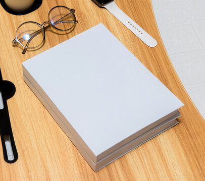 Mockup image of two books with white blank hardcover