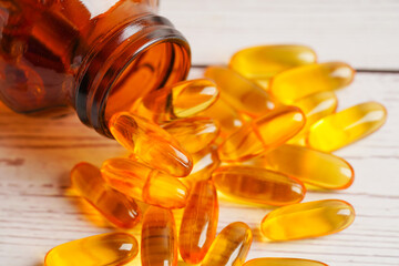 Fish oil or Cod liver oil gel in capsules with omega 3 vitamins, supplementary healthy food