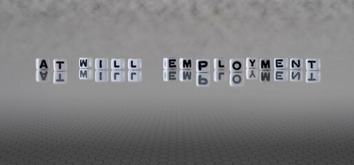 at will employment word or concept represented by black and white letter cubes on a grey horizon background stretching to infinity - obrazy, fototapety, plakaty