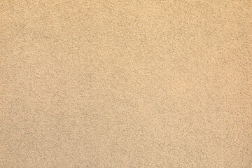 Texture of beige plaster wall as background