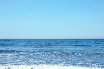 Naklejka na ściany i meble Picturesque view of beautiful sea and blue sky on sunny day