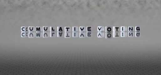cumulative voting word or concept represented by black and white letter cubes on a grey horizon...