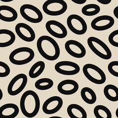 Seamless neutral oval pattern. Black hand-drawn rings isolated on beige background. Doodle dots cozy ovate ornament. Vector illustrations with circles for wallpaper, posters, wrapping paper, fabric