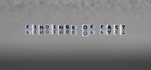 findings of fact word or concept represented by black and white letter cubes on a grey horizon background stretching to infinity