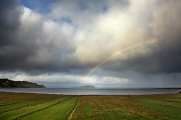Naklejka na ściany i meble Rainbow over Staffin Island, Scotland