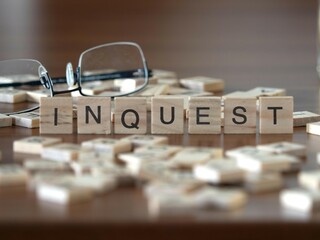 inquest word or concept represented by wooden letter tiles on a wooden table with glasses and a book