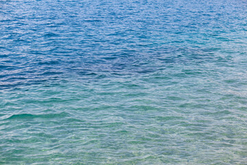 Seascape of clear water on the sea. Clear water on the ocean, sea or lake. Water ripples in the sun.