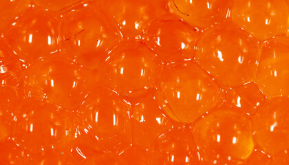 Red caviar as an abstract background.