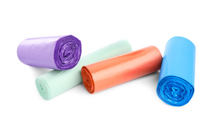Rolls of different color garbage bags isolated on white