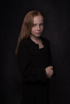 classic studio portrait of a young woman in dark Rembrandt style