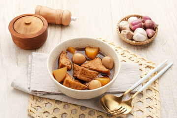 Semur, Indonesian traditional food, with tofu, quail eggs and potatoes, served in a bowl