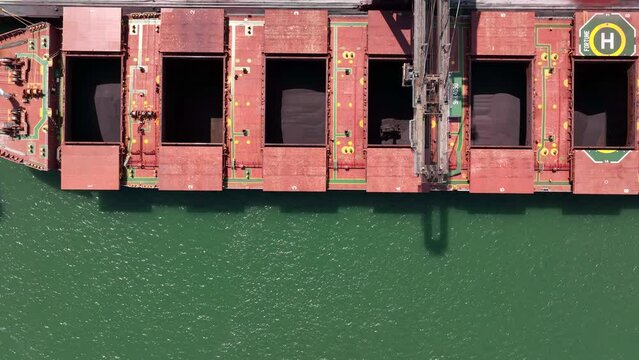 Bird's Eye View of a Bulk Carrier Ship Being Unloaded