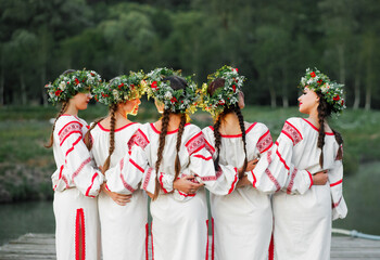 Ladies Wearing Ukraine National Garment Relaxing in Nature and Celebrate Ivana Kupala Summer Season Holiday - obrazy, fototapety, plakaty