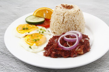 Freshly cooked Filipino food called Cornsilog or corned beef, egg and fried rice